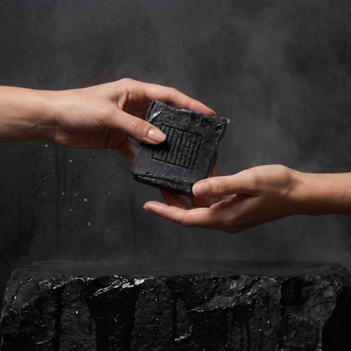 hands passing the wosh soap in the shower